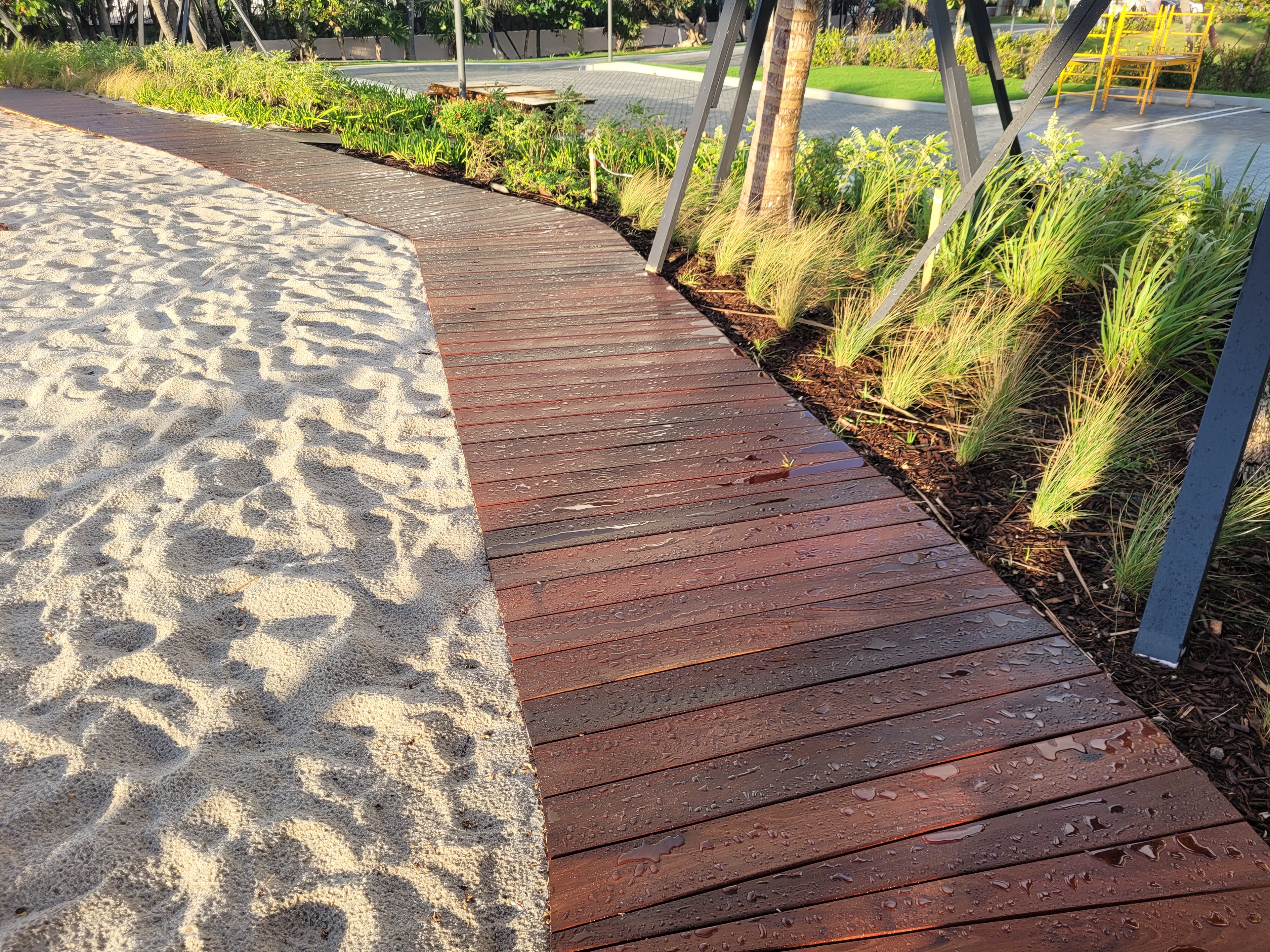 Ritz-Carlton Residences Pompano Beach — Ipe boardwalk through landscaped garden