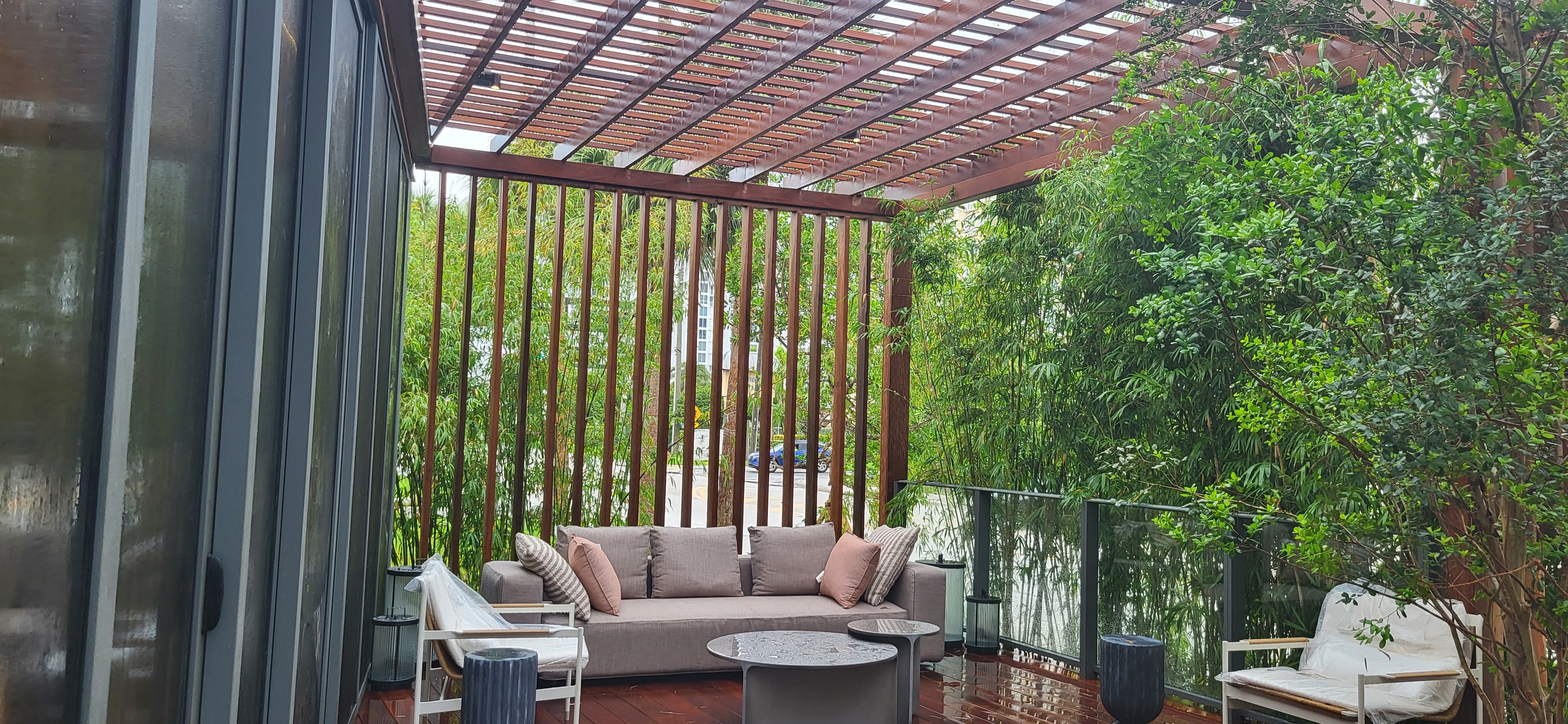 Waldorf Astoria Pompano Beach — patio with pergola and lounge seating