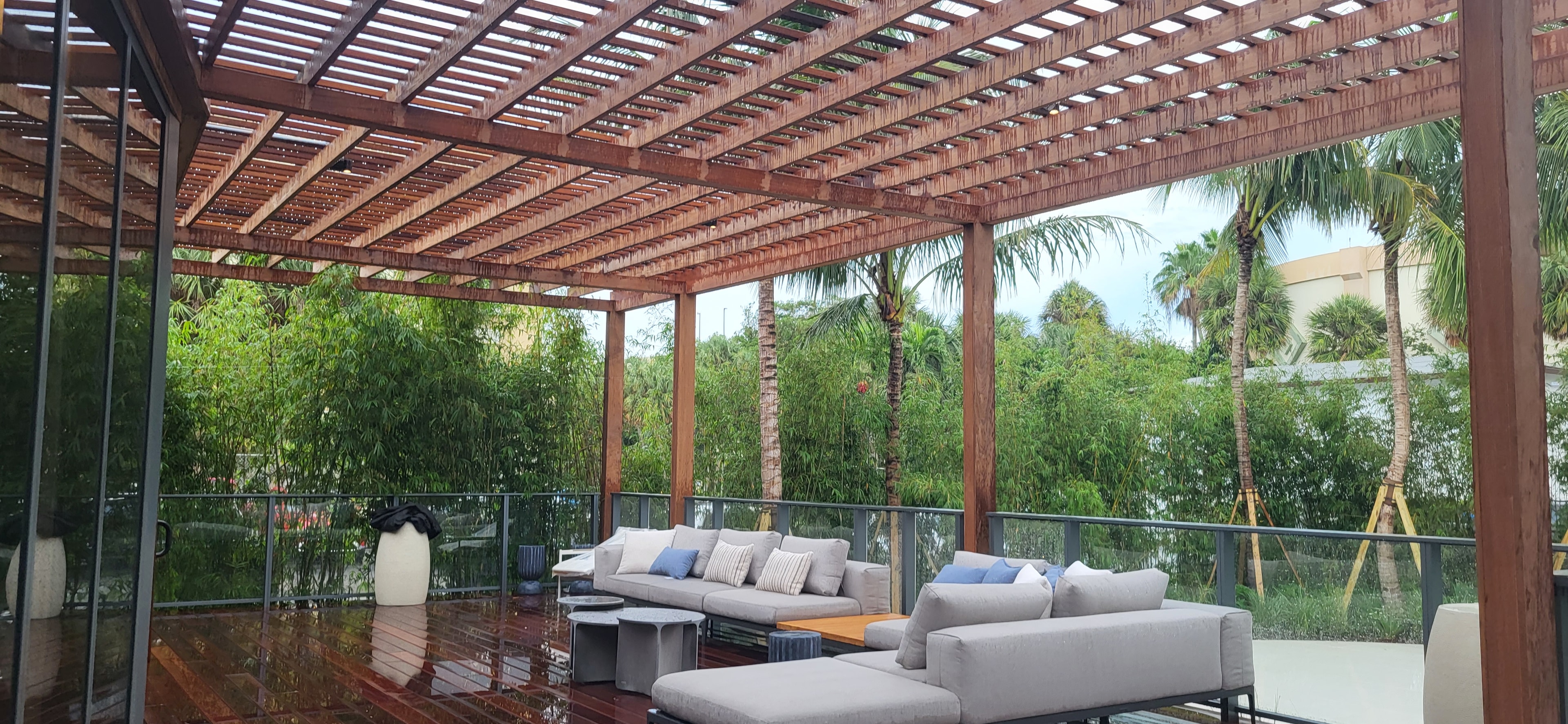 Waldorf Astoria Pompano Beach — pergola patio overlooking tropical landscape