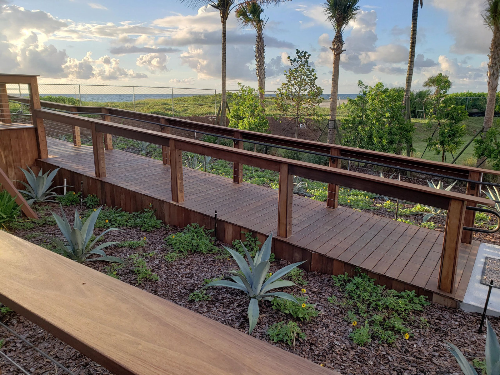 Ipe ADA ramp with cable railing — accessible ramp and cable railing system by Deckmasters